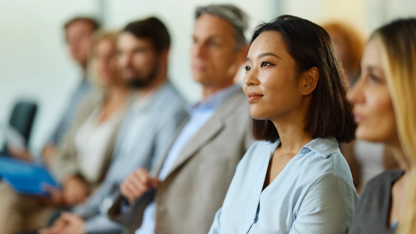 woman in group listening attentively image